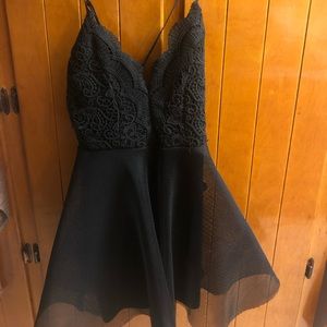 Black lace body con dress with a flared skirt!